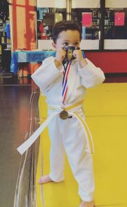 little boy in a karate stance