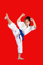 little girl throwing a roudhouse kick